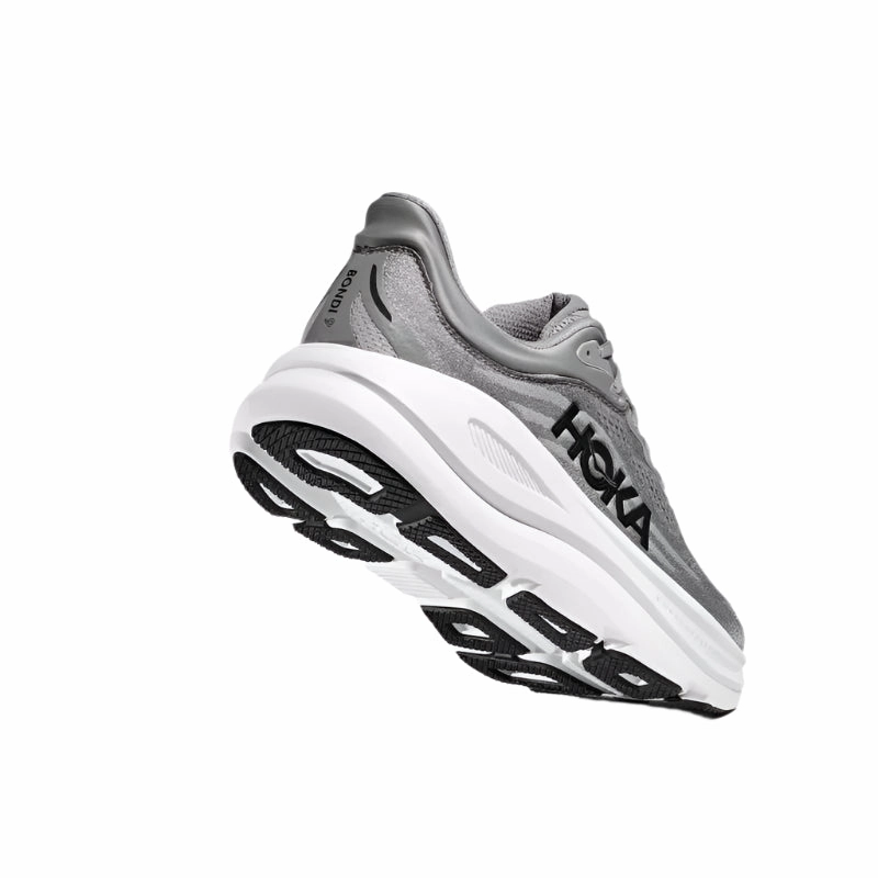 running in a monorail station area shoes HOKA Bondi 9 D Mens Running Shoes